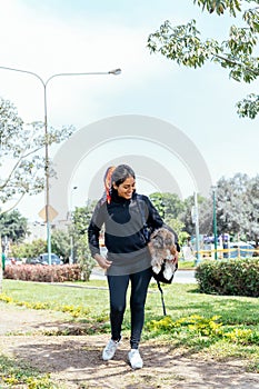 Woman enjoying a walk with her dog in the park
