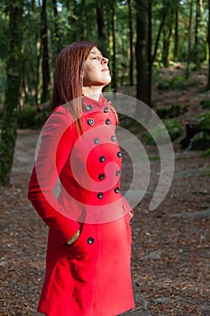 Woman enjoying the warmth of the winter sunlight