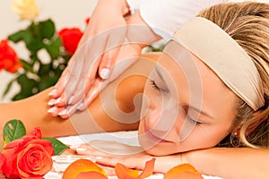 Woman enjoying wellness back massage
