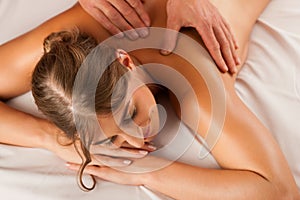 Woman enjoying wellness back massage