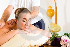 Woman enjoying wellness back massage