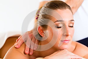 Woman enjoying wellness back massage