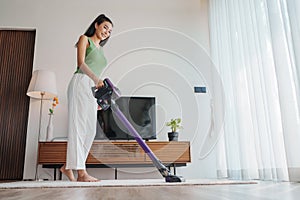 Woman enjoys cleaning at home