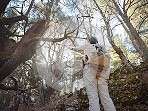 woman enjoys nature, beautiful forest in mountains