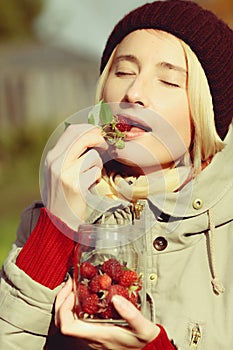 Woman enjoys raspberry