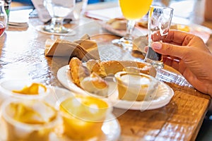 Woman Enjoys Warm Pretzels and Micro Brew Beer