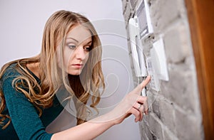 The woman entering code into the keypad