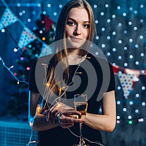 Woman in evening dress with glass of sparkling wine Celebration new year, christmas