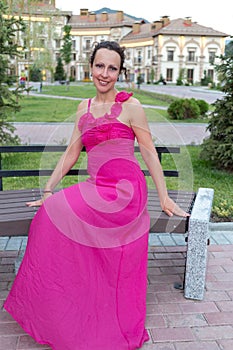 woman in evening dress sitting on a