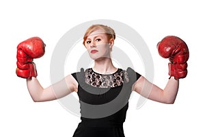 Woman in evening dress wearing boxing glove