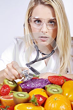 Woman examined many fruits