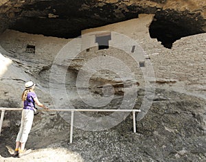 A Woman Examines Cave 2 at the Gila Cliff Dwellings