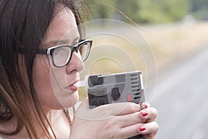 Woman examines the level of alcohol