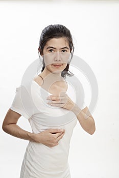 Woman examining herself for breast cancer