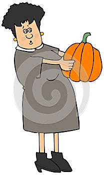 Woman examining a large pumpkin