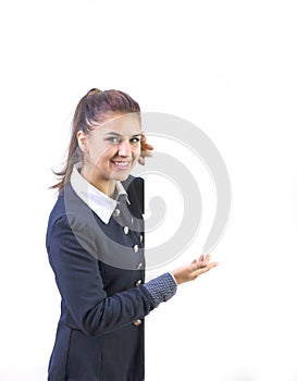 Woman excited pointing on empty blank billboard paper sign board. Young business woman isolated on white background