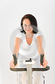Woman on exercise bicycle