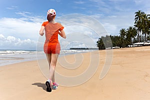 Woman exercise jogging on beach in vacation