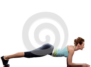 Woman exercising Abdominals workout push ups photo