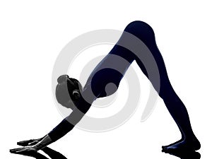 Woman exercising Adho Mukha Svanasana Downward Facing Dog pose y