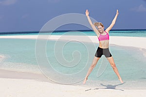 Woman Exercising On Beautiful Beach