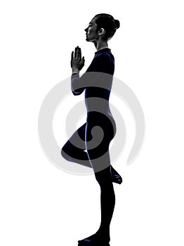 Woman exercising bhujangasana cobra pose yoga silhouette