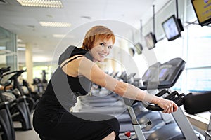 Woman exercising on bike