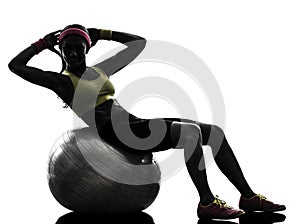 Woman exercising crunches fitness ball workout silhouette