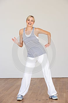 Woman Exercising In Dance Studio