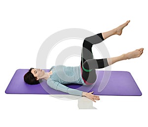 Woman exercising doing postnatal workout. Female fitness instructor working out with a rubber resistance band isolated on white