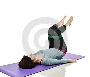 Woman exercising doing postnatal workout. Female fitness instructor working out with a rubber resistance band isolated on white