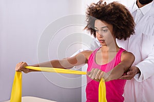 Woman Exercising With Exercise Band