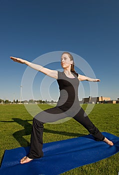 Woman exercising in field