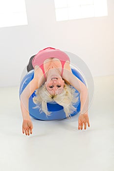 Woman exercising with fitness ball