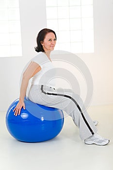 Woman exercising with fitness ball