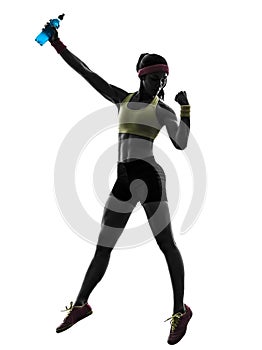 Woman exercising fitness holding energy drink silhouette