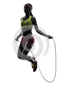 Woman exercising fitness jumping rope silhouette