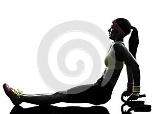 Woman exercising fitness push ups with holders silhouette photo
