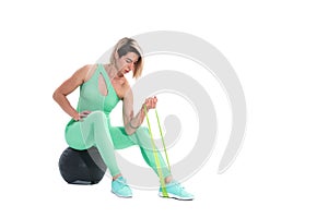 Woman exercising fitness resistance bands in studio silhouette i