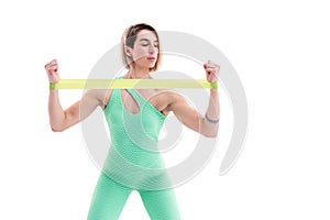 Woman exercising fitness resistance bands in studio silhouette i