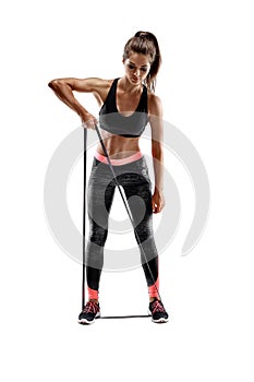 Woman exercising fitness resistance bands in studio silhouette isolated on white background