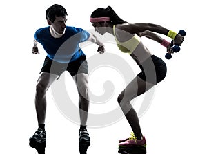 Woman exercising fitness weight training with man coach