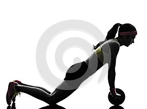 woman exercising fitness workout abdominal toning wheel silhouette photo