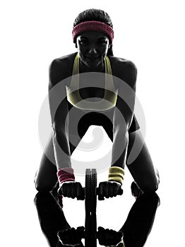woman exercising fitness workout abdominal toning wheel silhouette photo