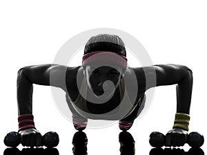 Woman exercising fitness workout push ups silhouette