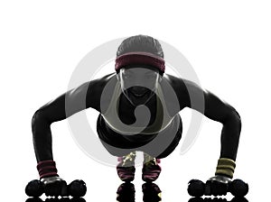 Woman exercising fitness workout push ups silhouette