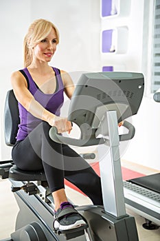Woman exercising in gym.