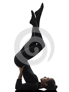 Woman exercising gymnastic salamba sarvangasana Shoulder Stand y