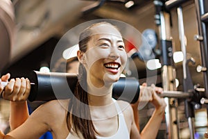 woman exercising on multi trainer machine