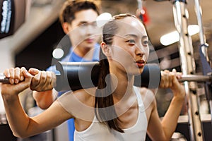 woman exercising on multi trainer machine